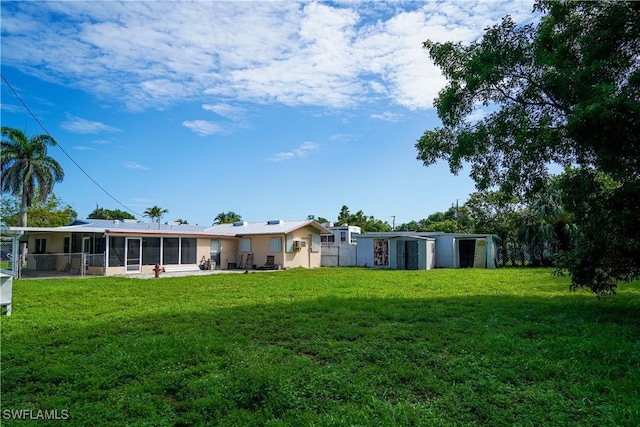 4180 Coconut Cir S, Naples, FL 34104 - view of grassy yard featuring a sunroom