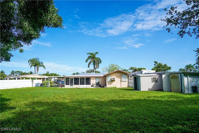 4180 Coconut Cir S, Naples, FL 34104 - back of property featuring a sunroom and a storage shed