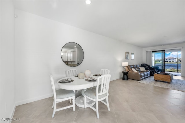 14044 Hunter Oak Dr, Fort Myers, FL 33913 - dining area with light tile patterned flooring