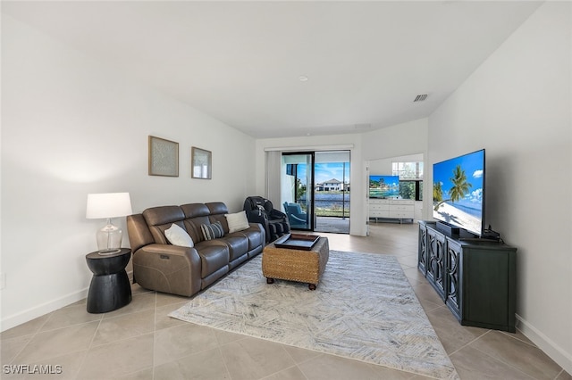 14044 Hunter Oak Dr, Fort Myers, FL 33913 - living room with baseboards and light tile patterned floors
