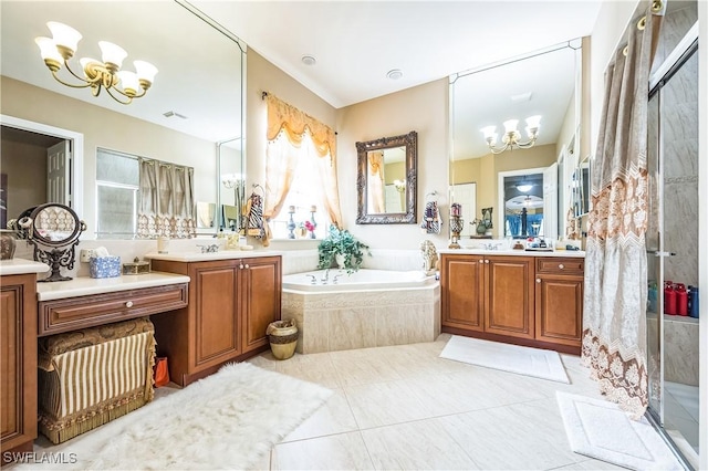 1841 Senegal Date Dr, Naples, FL 34119 - full bath with a chandelier, a shower stall, a garden tub, and two vanities