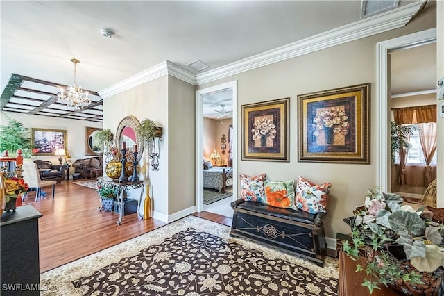 1841 Senegal Date Dr, Naples, FL 34119 - corridor with a chandelier, crown molding, and wood finished floors
