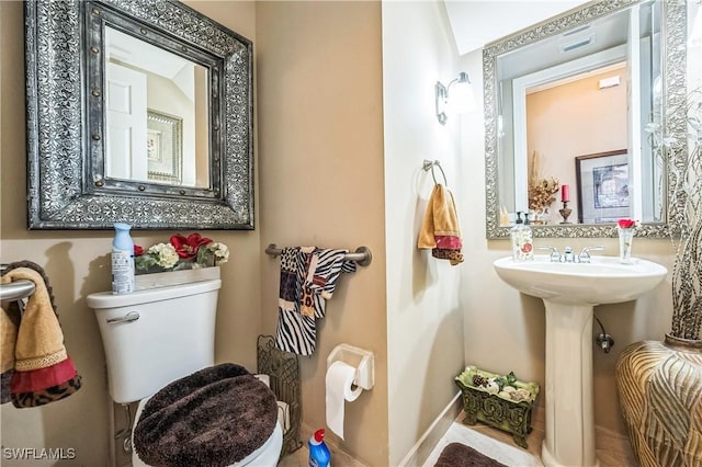 1841 Senegal Date Dr, Naples, FL 34119 - half bathroom with toilet and baseboards