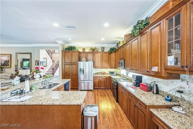 1841 Senegal Date Dr, Naples, FL 34119 - kitchen featuring black appliances, brown cabinets, light wood-style flooring, light stone countertops, and glass insert cabinets