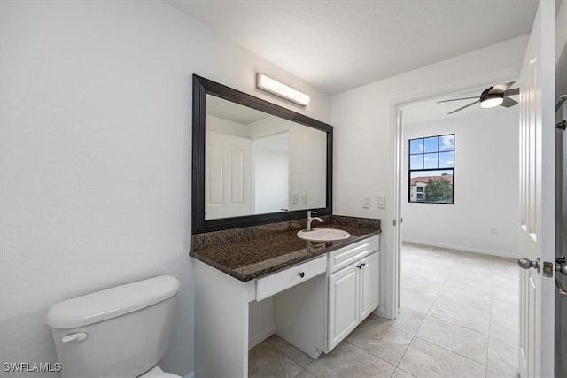 12980 Positano Cir Unit 306, Naples, FL 34105 - bathroom featuring vanity, tile patterned floors, and ceiling fan