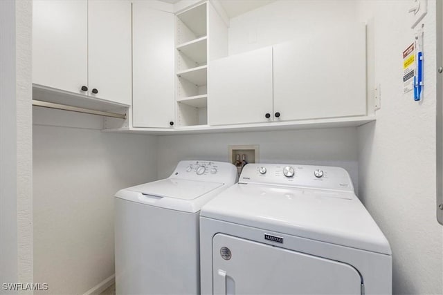 12980 Positano Cir Unit 306, Naples, FL 34105 - laundry area with independent washer and dryer and cabinet space