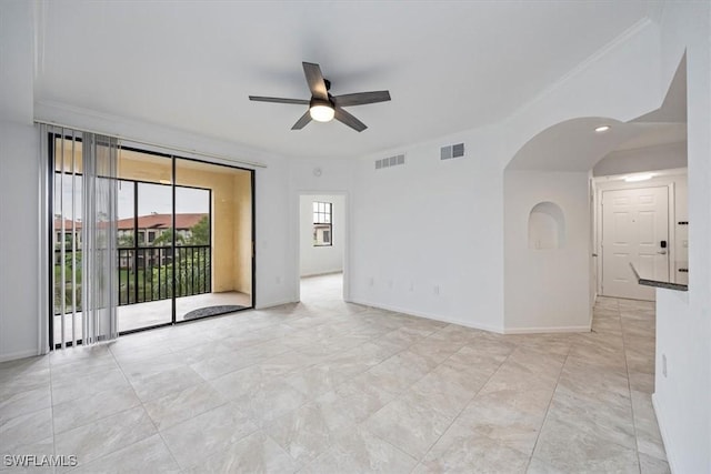 12980 Positano Cir Unit 306, Naples, FL 34105 - spare room featuring a ceiling fan and arched walkways