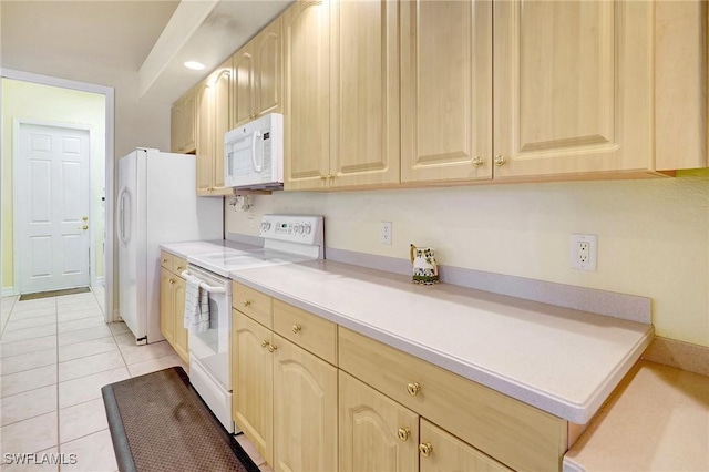 3206 SW 4th Ln, Cape Coral, FL 33991 - kitchen featuring white appliances, light brown cabinetry, light countertops, and light tile patterned floors
