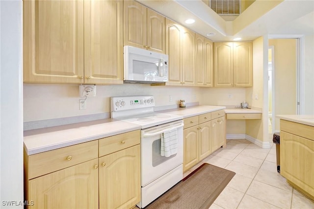 3206 SW 4th Ln, Cape Coral, FL 33991 - kitchen with white appliances, light brown cabinetry, light countertops, light tile patterned floors, and recessed lighting