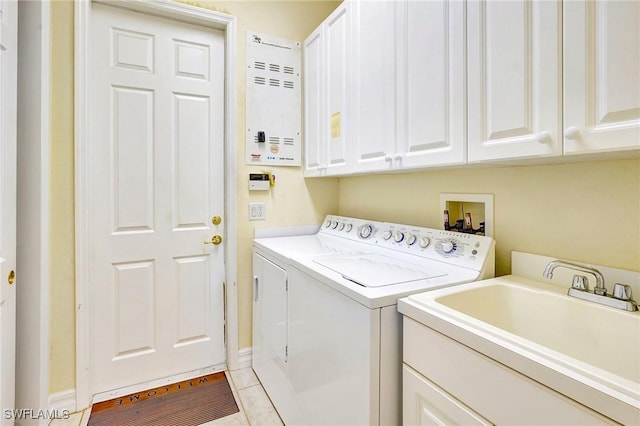 3206 SW 4th Ln, Cape Coral, FL 33991 - laundry room featuring cabinet space, washer and clothes dryer, and light tile patterned flooring