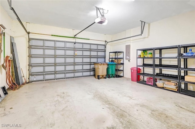3206 SW 4th Ln, Cape Coral, FL 33991 - garage featuring electric panel and a garage door opener