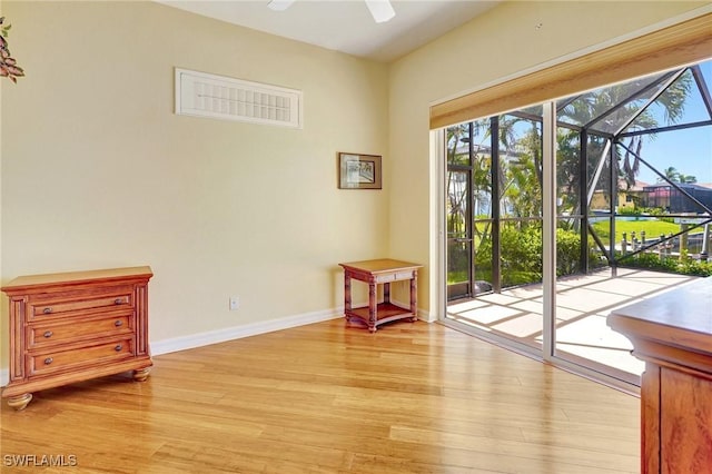 3206 SW 4th Ln, Cape Coral, FL 33991 - entryway featuring light wood-type flooring, healthy amount of natural light, and a ceiling fan