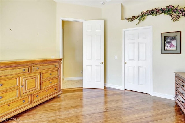 3206 SW 4th Ln, Cape Coral, FL 33991 - bedroom featuring light wood-type flooring and baseboards
