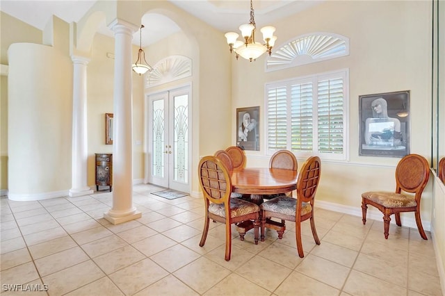 3206 SW 4th Ln, Cape Coral, FL 33991 - dining room with decorative columns, plenty of natural light, light tile patterned flooring, a high ceiling, and french doors