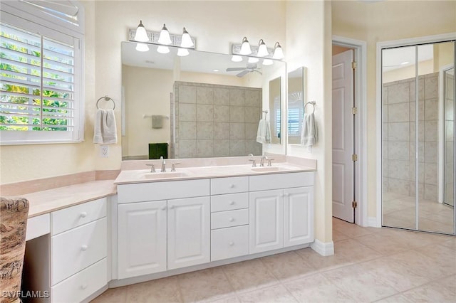 3206 SW 4th Ln, Cape Coral, FL 33991 - bathroom featuring a stall shower, ceiling fan, double vanity, and tile patterned floors