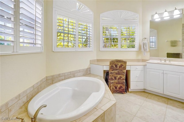 3206 SW 4th Ln, Cape Coral, FL 33991 - full bath featuring a garden tub, vanity, and tile patterned floors