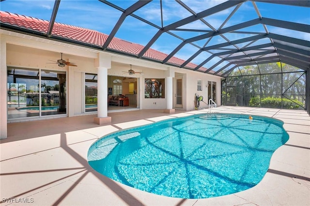 3206 SW 4th Ln, Cape Coral, FL 33991 - swimming pool with a patio, a ceiling fan, and glass enclosure