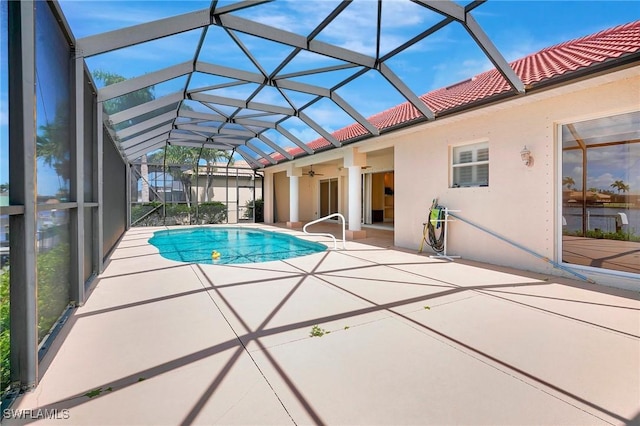 3206 SW 4th Ln, Cape Coral, FL 33991 - outdoor pool featuring a patio area, a ceiling fan, and glass enclosure