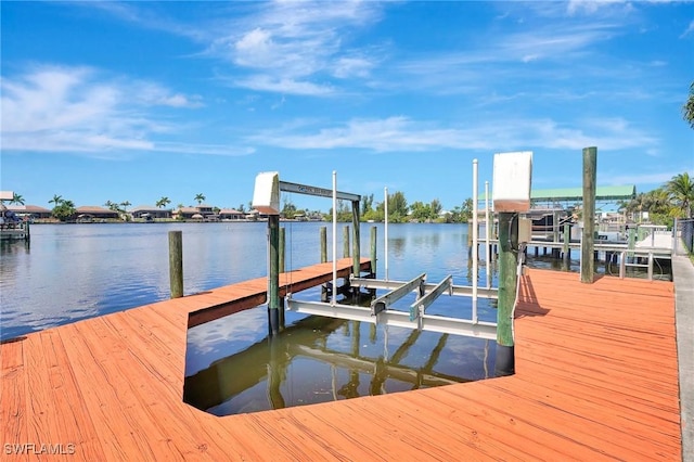 3206 SW 4th Ln, Cape Coral, FL 33991 - dock area featuring boat lift and a water view