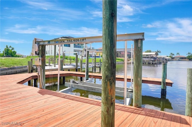 3206 SW 4th Ln, Cape Coral, FL 33991 - dock area with boat lift and a water view