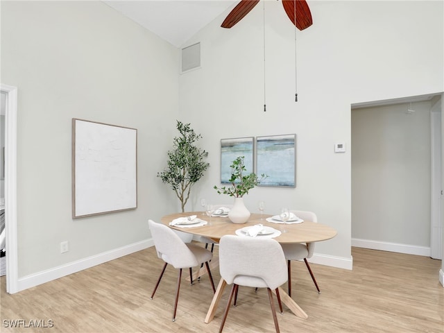 1492 La Petite Ct, Naples, FL 34104 - dining space with high vaulted ceiling, light wood-style floors, and a ceiling fan