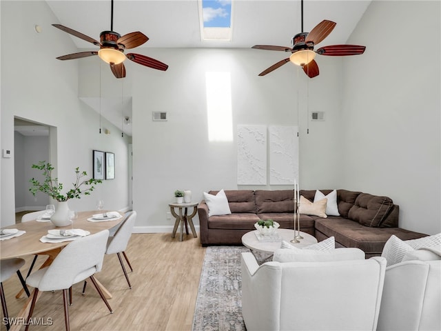 1492 La Petite Ct, Naples, FL 34104 - living area featuring high vaulted ceiling, ceiling fan, and light wood finished floors