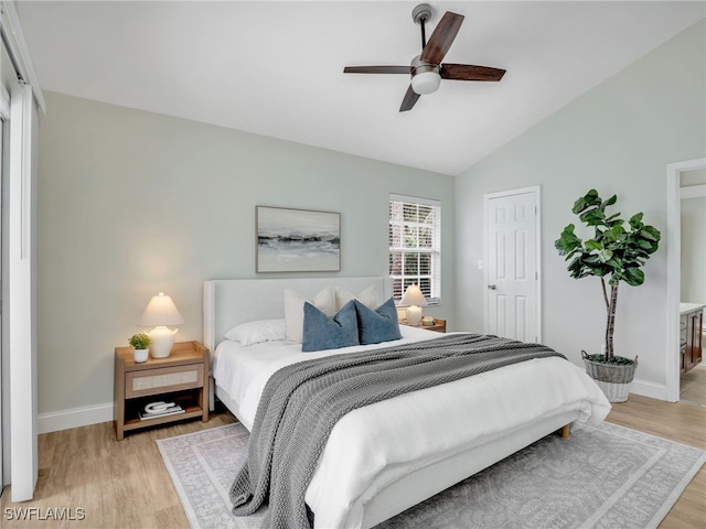 1492 La Petite Ct, Naples, FL 34104 - bedroom with light wood-style floors, vaulted ceiling, and ceiling fan