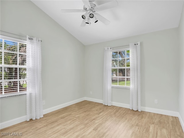 1492 La Petite Ct, Naples, FL 34104 - unfurnished room featuring wood finished floors, healthy amount of natural light, lofted ceiling, and a ceiling fan