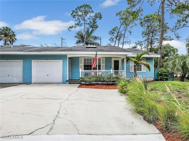 1492 La Petite Ct, Naples, FL 34104 - single story home with a porch, driveway, and a garage