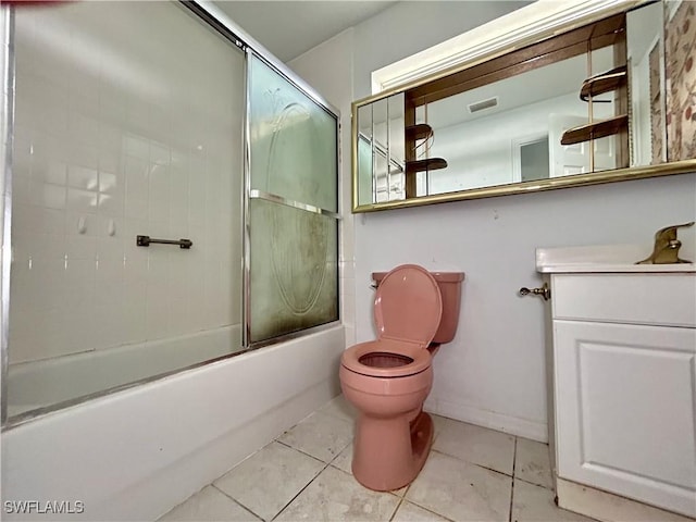 211 Oakmont Pkwy, Lehigh Acres, FL 33936 - bathroom with vanity, tile patterned flooring, and combined bath / shower with glass door