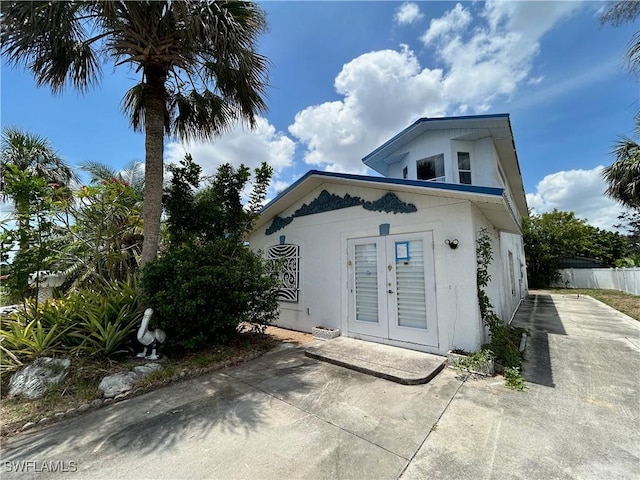 211 Oakmont Pkwy, Lehigh Acres, FL 33936 - view of front of home with french doors