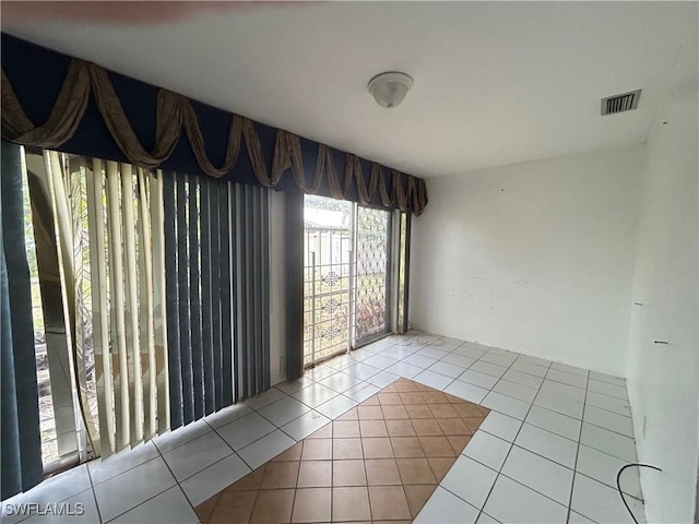 211 Oakmont Pkwy, Lehigh Acres, FL 33936 - unfurnished room with tile patterned flooring