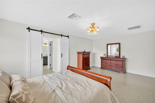 867 Oak St, Fort Myers Beach, FL 33931 - bedroom with dark speckled floor, a barn door, and a chandelier