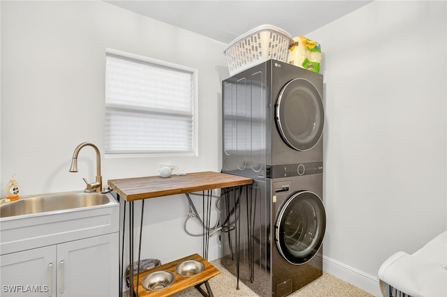 867 Oak St, Fort Myers Beach, FL 33931 - laundry room featuring stacked washer / drying machine and cabinet space