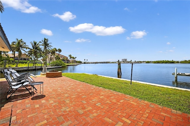 867 Oak St, Fort Myers Beach, FL 33931 - view of patio / terrace with a water view, a fire pit, and a boat dock