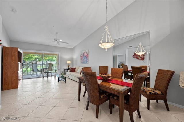 2456 Millcreek Ln Unit 201, Naples, FL 34119 - dining room featuring ceiling fan, high vaulted ceiling, and light tile patterned flooring