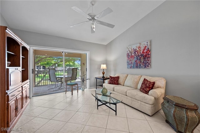 2456 Millcreek Ln Unit 201, Naples, FL 34119 - living room with vaulted ceiling, light tile patterned floors, and a ceiling fan