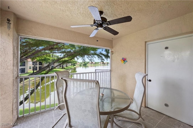 2456 Millcreek Ln Unit 201, Naples, FL 34119 - balcony featuring a water view and a ceiling fan