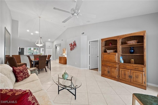 2456 Millcreek Ln Unit 201, Naples, FL 34119 - living area with vaulted ceiling, ceiling fan, and light tile patterned floors