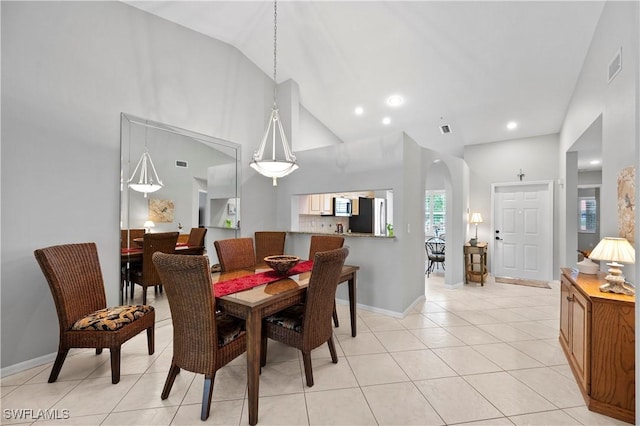 2456 Millcreek Ln Unit 201, Naples, FL 34119 - dining room featuring high vaulted ceiling, light tile patterned flooring, and recessed lighting
