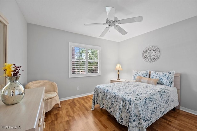 2456 Millcreek Ln Unit 201, Naples, FL 34119 - bedroom with wood finished floors and ceiling fan