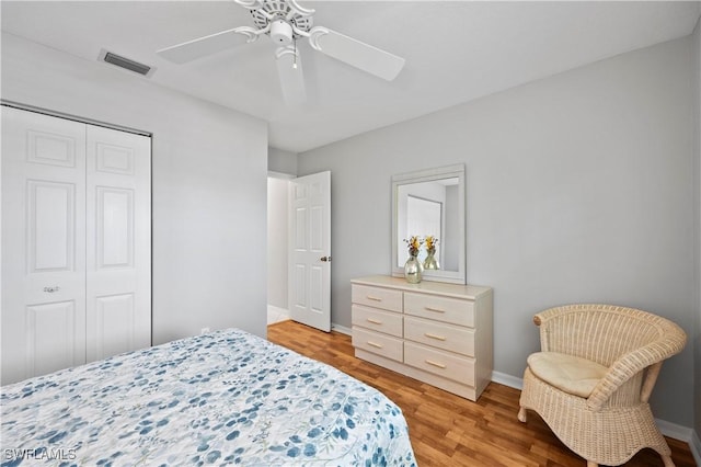 2456 Millcreek Ln Unit 201, Naples, FL 34119 - bedroom featuring a closet, light wood-style flooring, and a ceiling fan