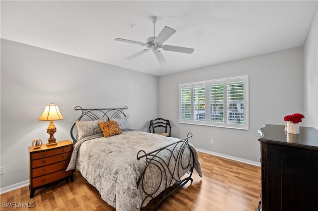 2456 Millcreek Ln Unit 201, Naples, FL 34119 - bedroom with wood finished floors and ceiling fan