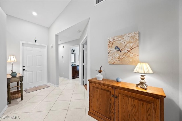 2456 Millcreek Ln Unit 201, Naples, FL 34119 - foyer entrance with light tile patterned floors and baseboards