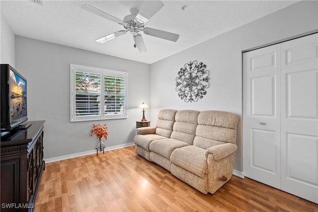 2456 Millcreek Ln Unit 201, Naples, FL 34119 - living room with a ceiling fan and light wood finished floors