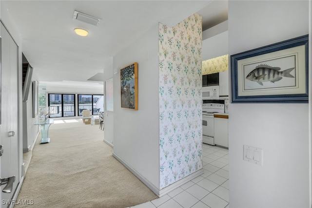 210 La Peninsula Blvd Unit 210, Naples, FL 34113 - corridor with tile patterned floors and carpet flooring