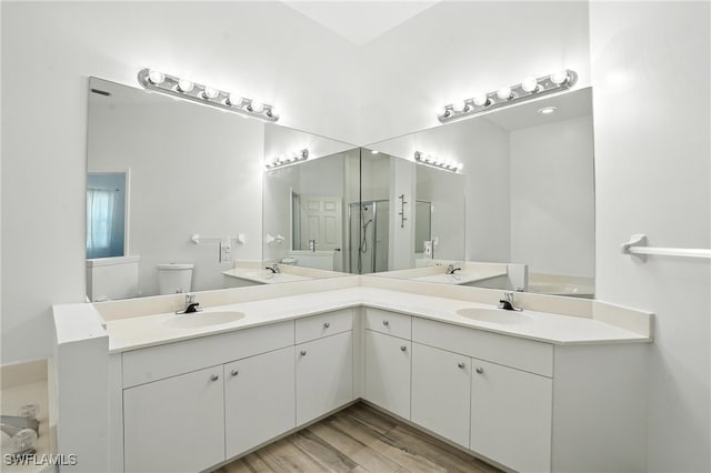 1000 L Ambiance Cir Unit 205, Naples, FL 34108 - bathroom featuring double vanity and wood finished floors