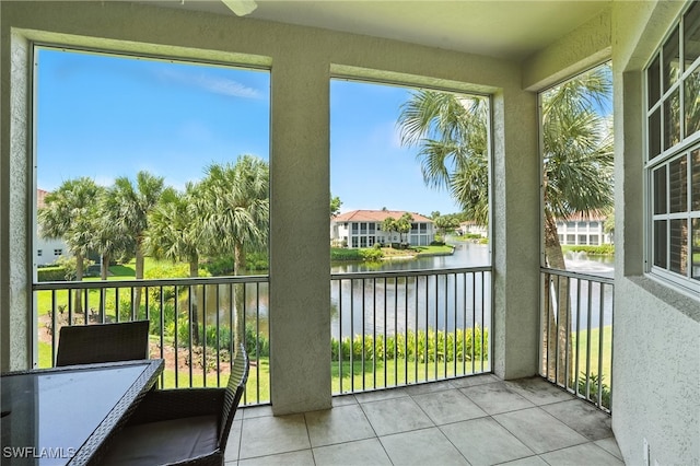 1000 L Ambiance Cir Unit 205, Naples, FL 34108 - unfurnished sunroom with a water view