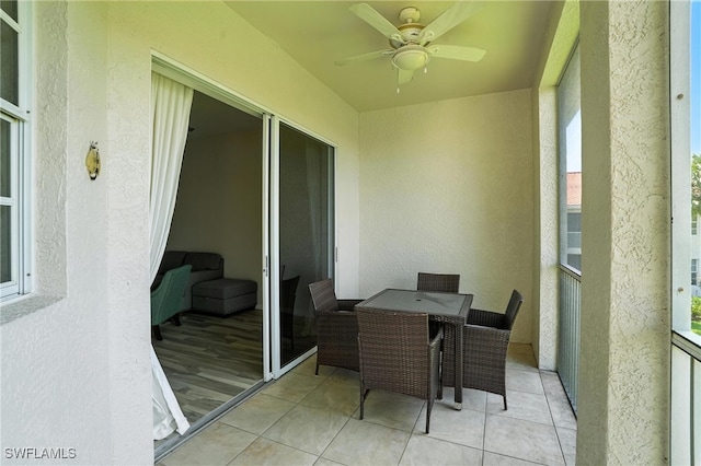 1000 L Ambiance Cir Unit 205, Naples, FL 34108 - sunroom with ceiling fan and outdoor dining space