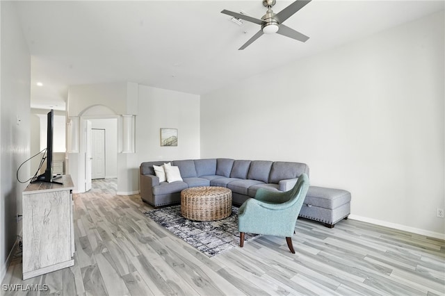 1000 L Ambiance Cir Unit 205, Naples, FL 34108 - living room featuring decorative columns, light wood-type flooring, and ceiling fan